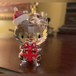 Swarovski Hello Kitty Santa Christmas figurine holding a present